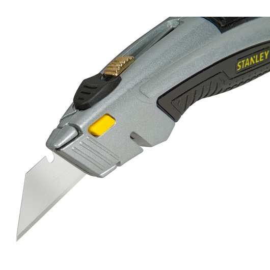 STANLEY 0-10-788 silver utility knife, angled view showing extended blade and black grip.
