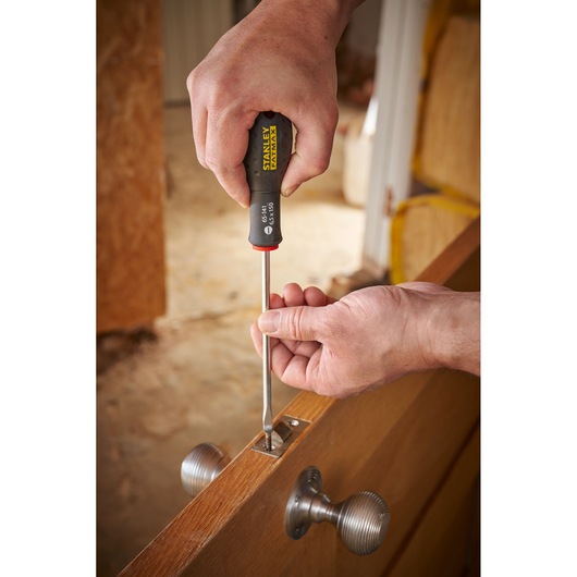 Photo of STANLEY 0-65-141 screwdriver used to install door lock hardware.