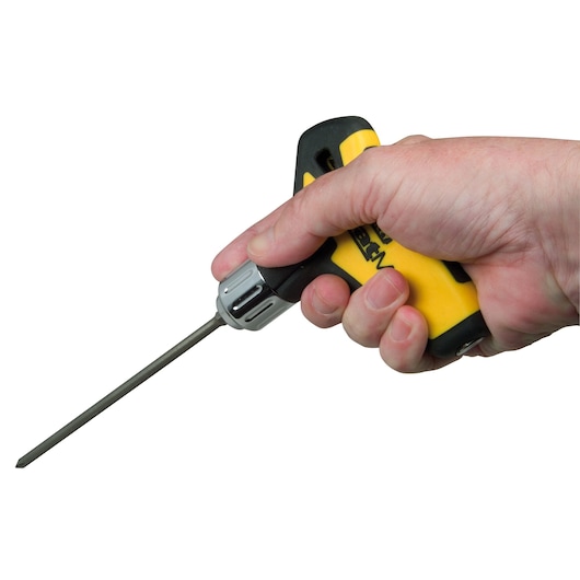 STANLEY 0-79-153 screwdriver with yellow and black ergonomic handle held in hand, side angle.