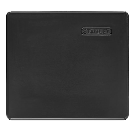 Rectangular black Stanley cutting mat with embossed logo in top right corner.