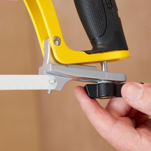 STANLEY 1-20-110 hacksaw close-up showing black adjustment knob and yellow handle.