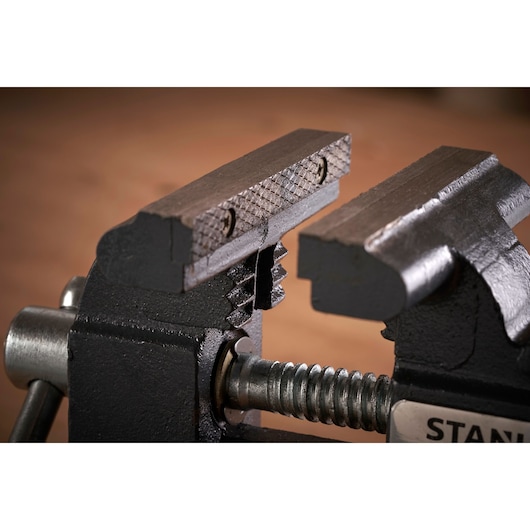 STANLEY 1-83-065 bench vise close-up showing textured steel jaws and screw mechanism, product photography.