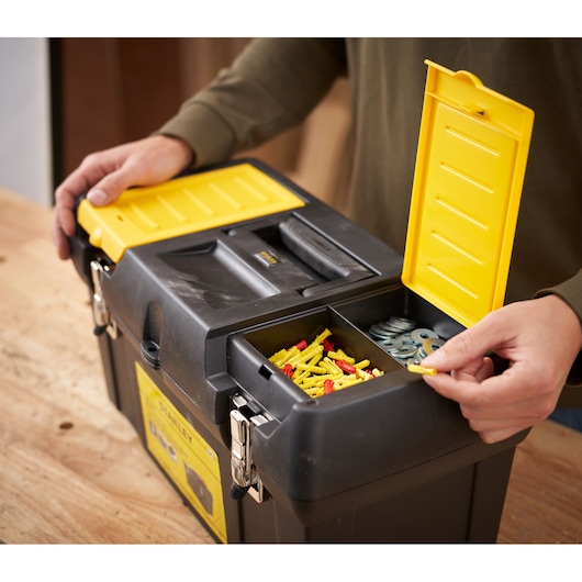STANLEY 1-92-066 black toolbox with yellow lid compartments on workbench, photography rear angle.