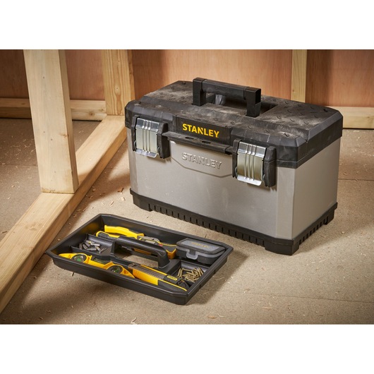 STANLEY 1-95-615 toolbox with removable tray, silver and black, in workshop setting.