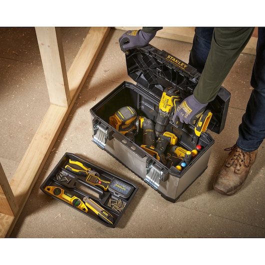 STANLEY 1-95-615 tool box with assorted hand tools and drill, photography from above.