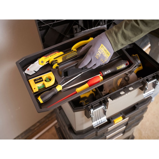 STANLEY 1-95-622 toolbox tray with assorted hand tools, including screwdrivers, utility knife, and level, top view.