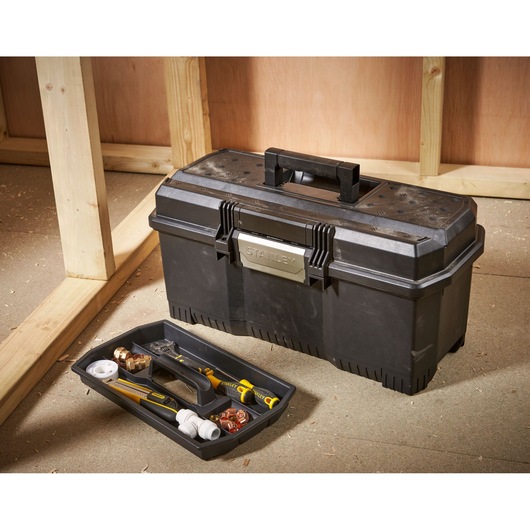 Stanley 1-97-510 toolbox with removable tray and assorted tools in construction setting.