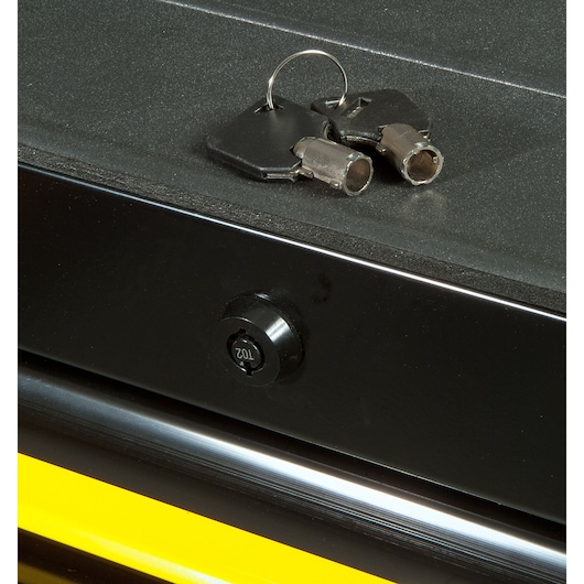 STANLEY FMHT0-74027 close-up of black lockable drawer with two tubular keys on top, front angle.