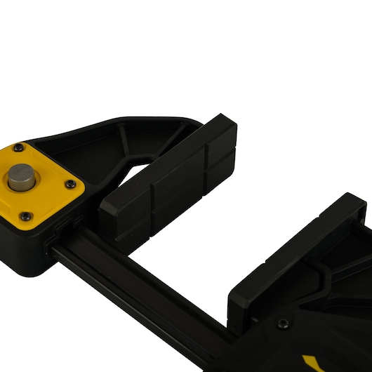 STANLEY FMHT0-83239 bar clamp close-up on white background, showing black and yellow jaws and adjustment mechanism.