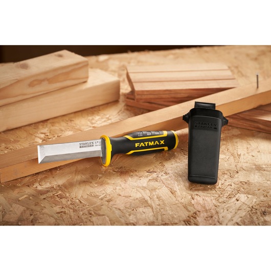 STANLEY FMHT16693-0 chisel with black and yellow handle and protective cover on wood surface.