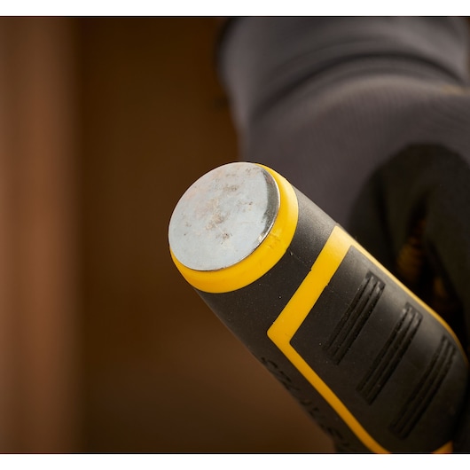 STANLEY FMHT16693-0 chisel close-up, showing steel strike cap and black and yellow anti-slip handle.