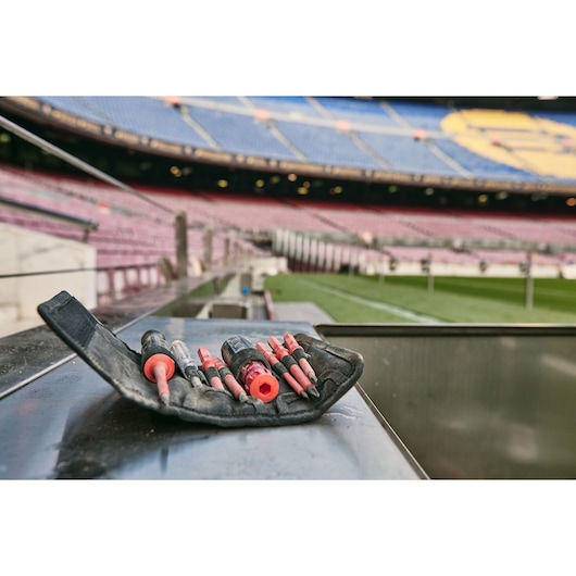 STANLEY FMHT66426-0 screwdriver set with red handles in black pouch, photographed in outdoor stadium.