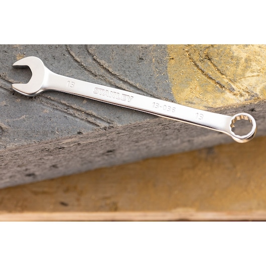Stanley FMMT13029-0 combination wrench, silver finish, size 13mm, shown on a textured surface.