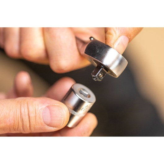 STANLEY FMMT17192-0 socket wrench with socket attachment close-up in hand, photography.