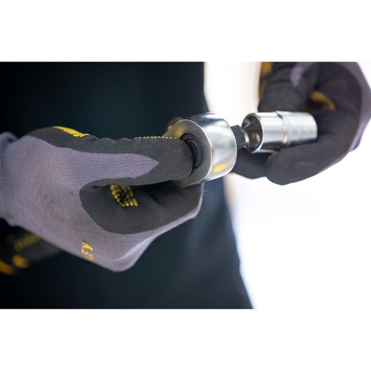 STANLEY FMMT17235-0 socket assembly shown in gloved hands, close-up, photography product category.