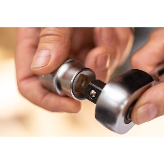 STANLEY FMMT17244-0 ratchet wrench and socket, close-up, photography of hand connecting tool.