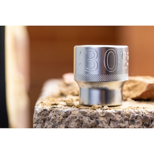 STANLEY FMMT17244-0 socket photography, silver finish, close-up side angle on a rough surface.