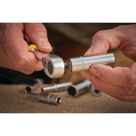 STANLEY FMMT17965-0 socket being attached to ratchet handle, close-up photography, socket set visible.