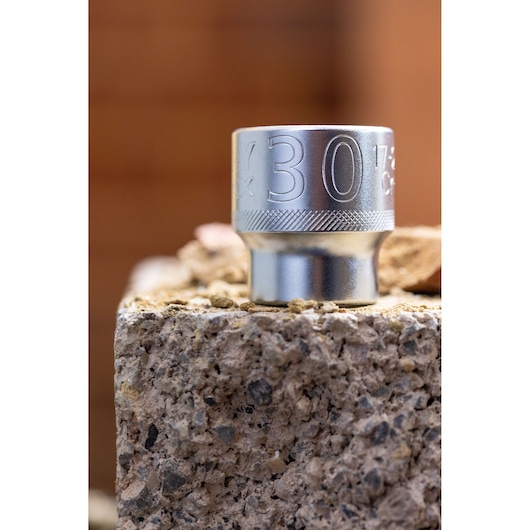 STANLEY FMMT82680-0 socket 30mm, close-up on rough stone surface, chrome finish.