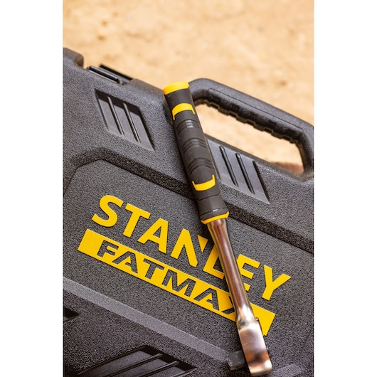 STANLEY FMMT82826-1 hand tool with black and yellow handle on STANLEY FATMAX case, angled top view.