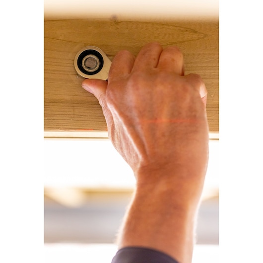 STANLEY FMMT82900-0 hand tool in use tightening bolt on wood, close-up photography.