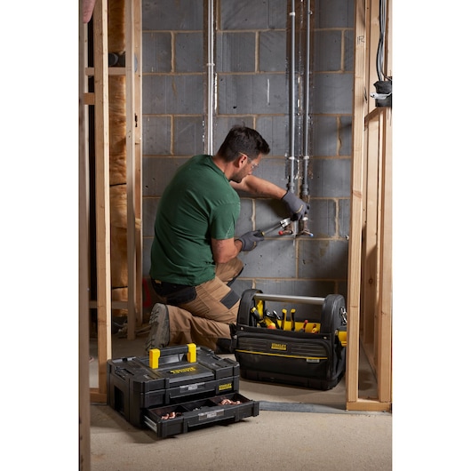 Stanley FMST1-71969 tool bag and organizer on site with tools, photo of product in use near wall construction.