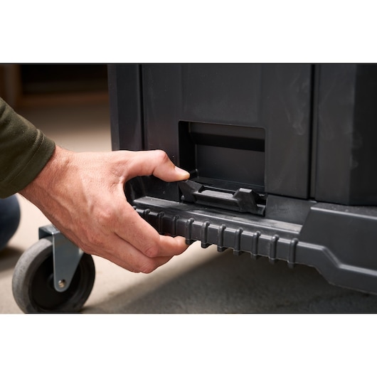 STANLEY FMST1-71972 wheeled toolbox close-up, hand unlocking latch, front angle.