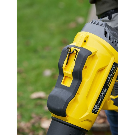 STANLEY SFMCBL7B leaf blower close-up, yellow and black body, outdoor use scene
