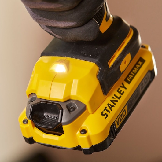STANLEY SFMCD720B cordless drill close-up showing yellow and black FATMAX V20 battery pack.