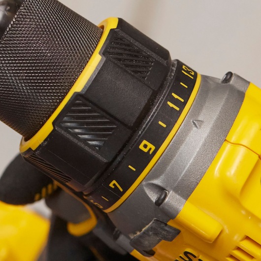 Close-up photo of STANLEY SFMCD720D2K cordless drill torque adjustment ring with yellow and black color.