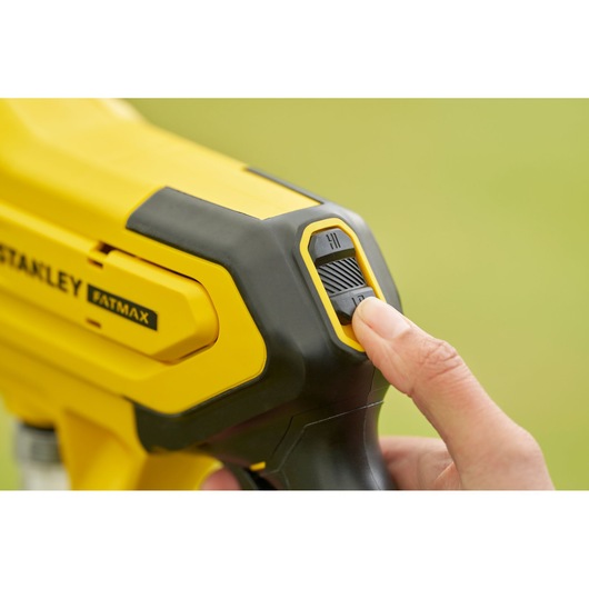 Photo of STANLEY SFMCPC93B photography tool showing close-up yellow control switch.