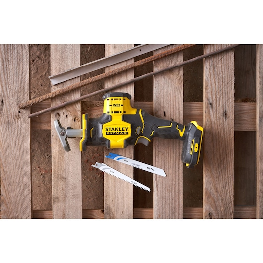 Stanley SFMCS305B reciprocating saw with yellow and black design shown with two saw blades on wood background.