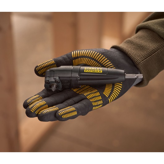 STANLEY STA88582 FatMax right angle screwdriver held in gloved hand, close-up photography.