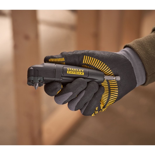 Photo of STANLEY STA88582 FATMAX angle screwdriver held in gloved hand, black and yellow tool.