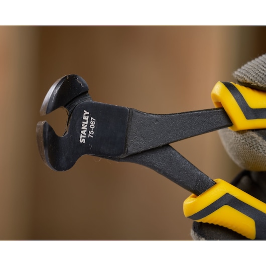 STANLEY STHT0-75067 end cutting pliers with yellow and black handles, close-up view.