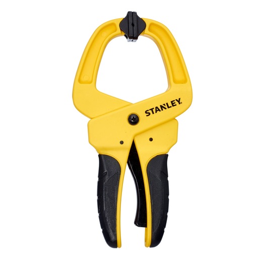 Yellow and black Stanley spring clamp tool with ergonomic handles for securing objects.