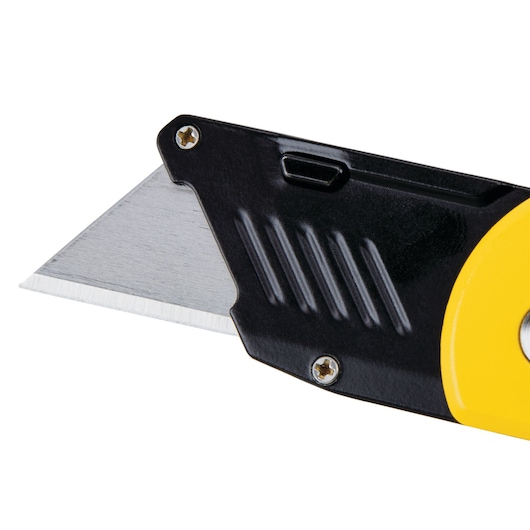 STANLEY STHT10424-0 utility knife close-up, showing exposed metal blade and yellow-black handle, side angle.