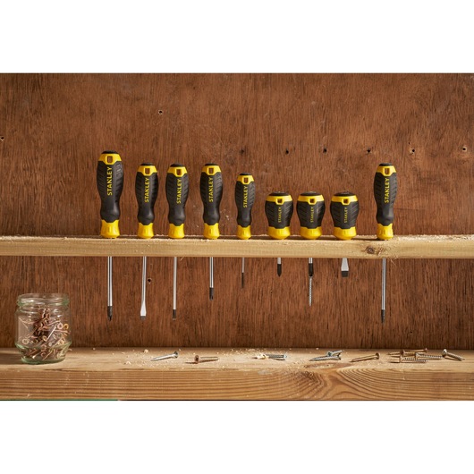 STANLEY STHT16163-0 screwdriver set with yellow and black handles, front view on wooden shelf.