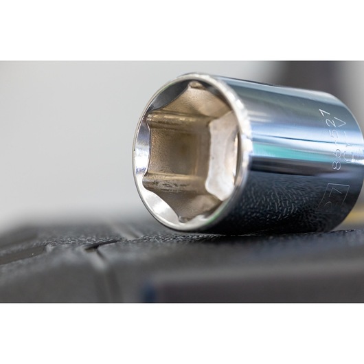 STANLEY STMT86317-0 chrome socket, close-up view, showing six-point design on black surface.