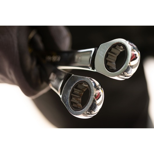 STANLEY STMT89916-0 ratcheting wrenches close-up, photography, chrome finish, held in a gloved hand.