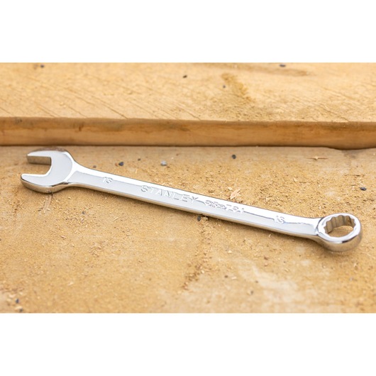 STANLEY STMT95908-0 spanner with open and ring ends on a wooden surface, side angle photography.