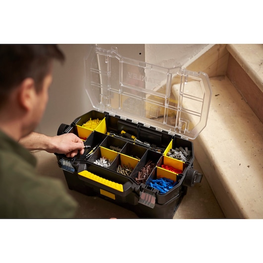 STANLEY STST1-70317 organizer box with yellow dividers and assorted hardware, photo at angled top view.