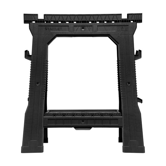 STANLEY STST1-70713 black plastic sawhorse, frontal view, with ribbed legs and deep top grooves.