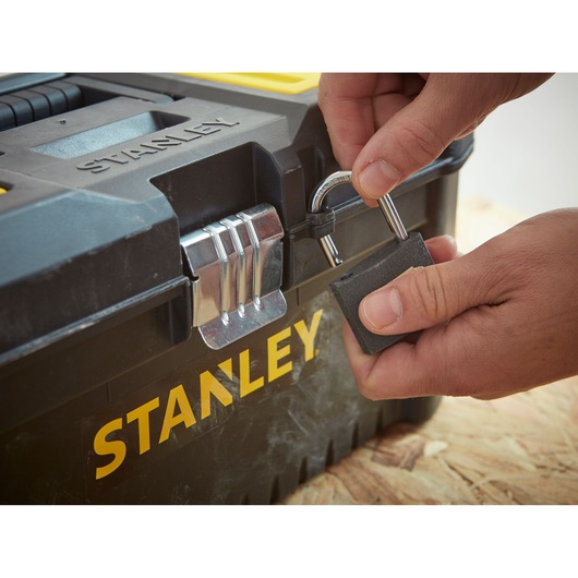 Photo of STANLEY STST1-75518-KR toolbox being locked with a padlock, close-up angle.