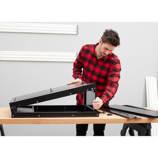 STANLEY STST97599-1 black metal storage assembly on wooden table, photography side angle.